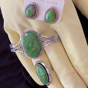 Southwest style green turquoise with copper accents. Set in Sterling silver.